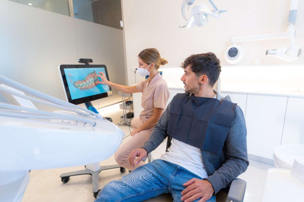 Dentist using modern technology to explain a dental procedure