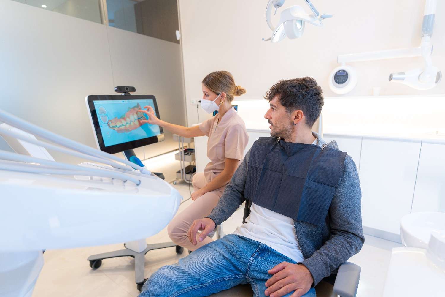 Dentist using modern technology to explain a dental procedure